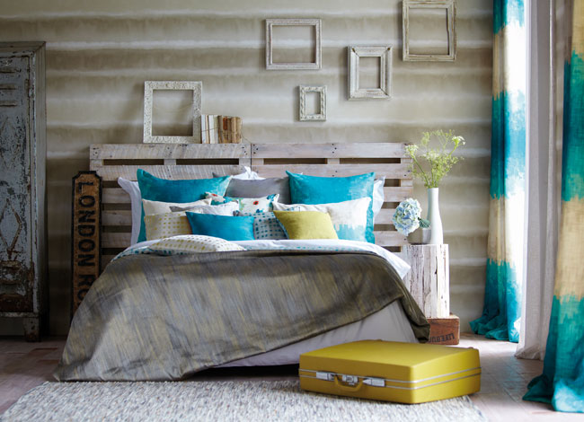 Cama con cojines - Villalba Interiorismo